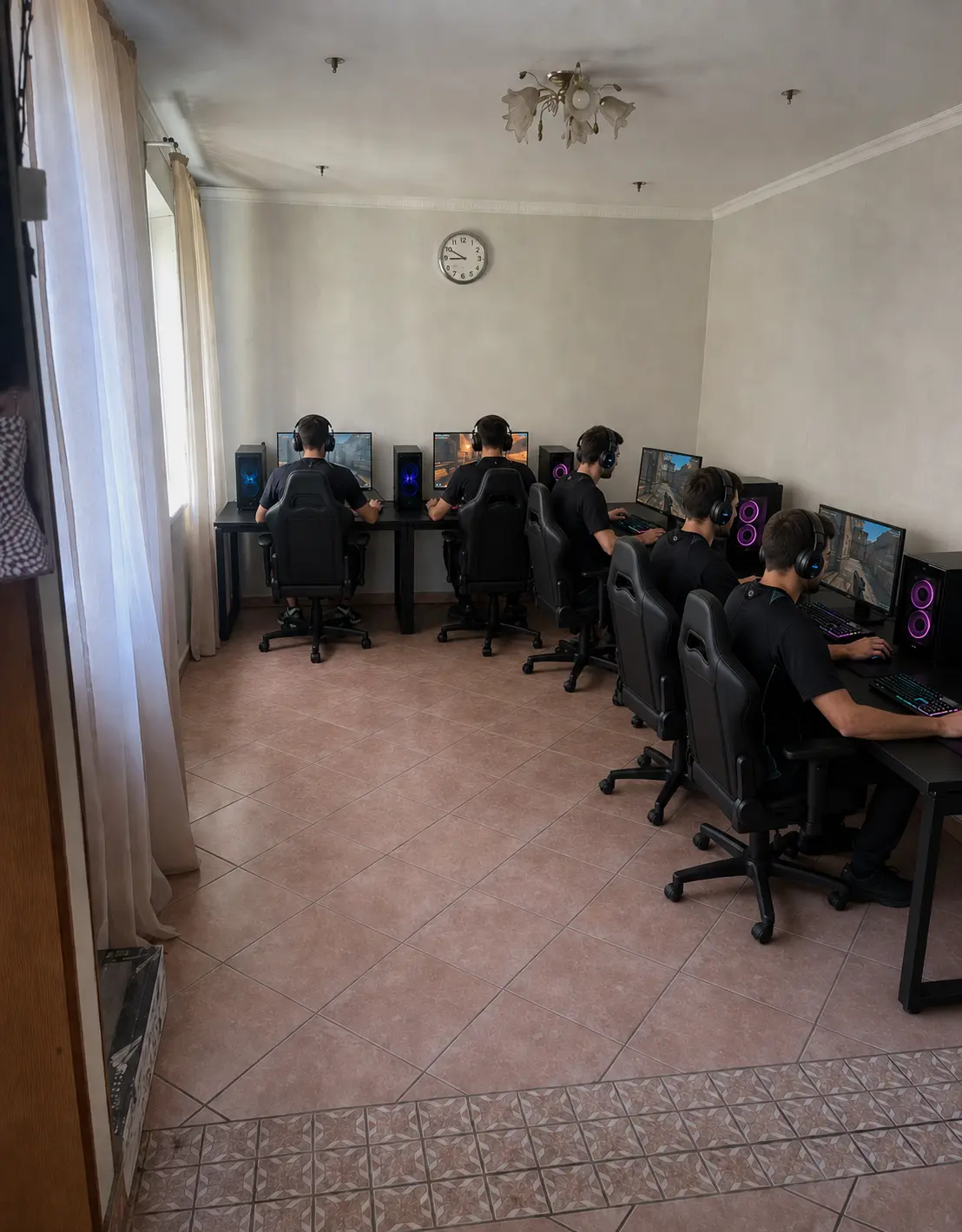 Five esports players training together in the team room